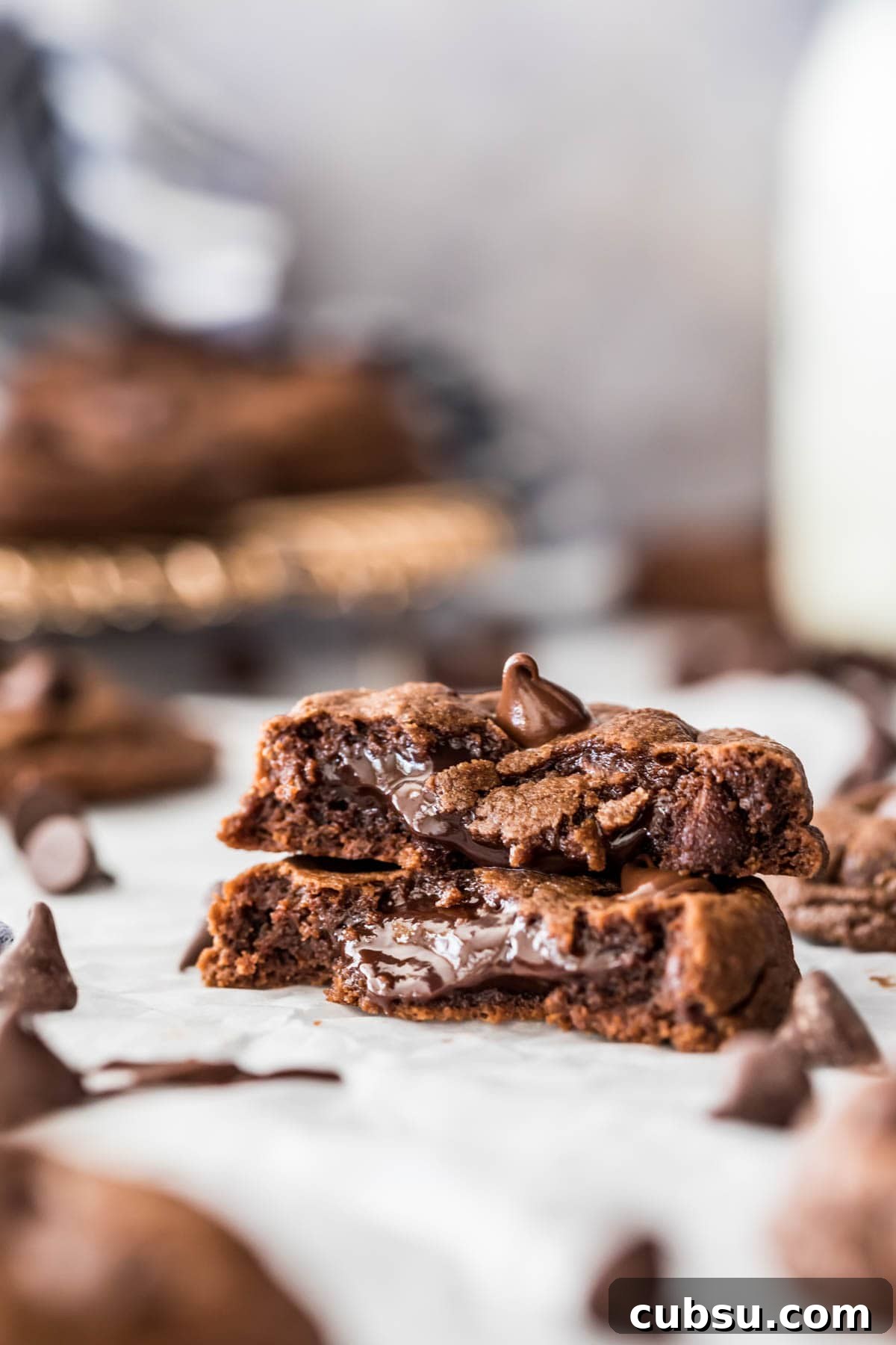 Chewy Fudge Chocolate Cookies Recipe 2 two halves of a chocolate fudge cookie stacked to show its soft, fudgy center
