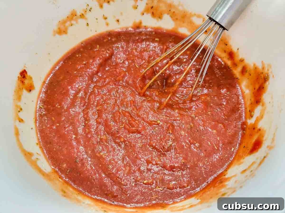 5-Minute Homemade Pizza Sauce Recipe You Can Make Fast 2 5 Minute Pizza Sauce whisked in a bowl.