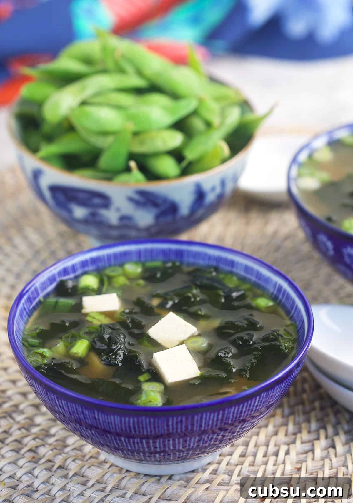 Authentic Miso Soup Recipe for Fast Weeknight Meals 3 A bowl of edamame is placed next to a bowl of miso soup.