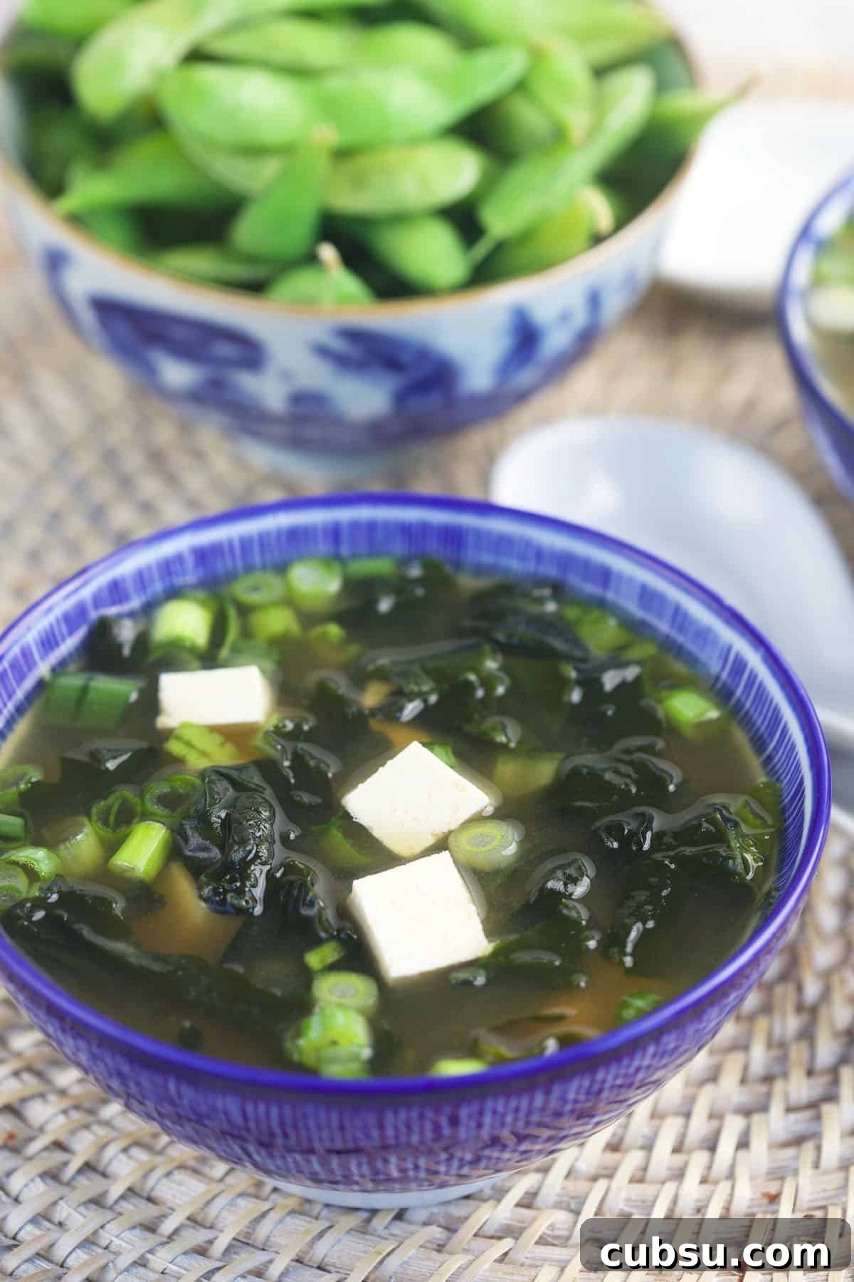 Authentic Miso Soup Recipe for Fast Weeknight Meals 4 A serving of miso soup is presented in a blue bowl.
