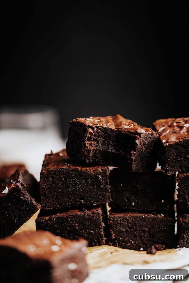 stack of crinkle top brownies with black background