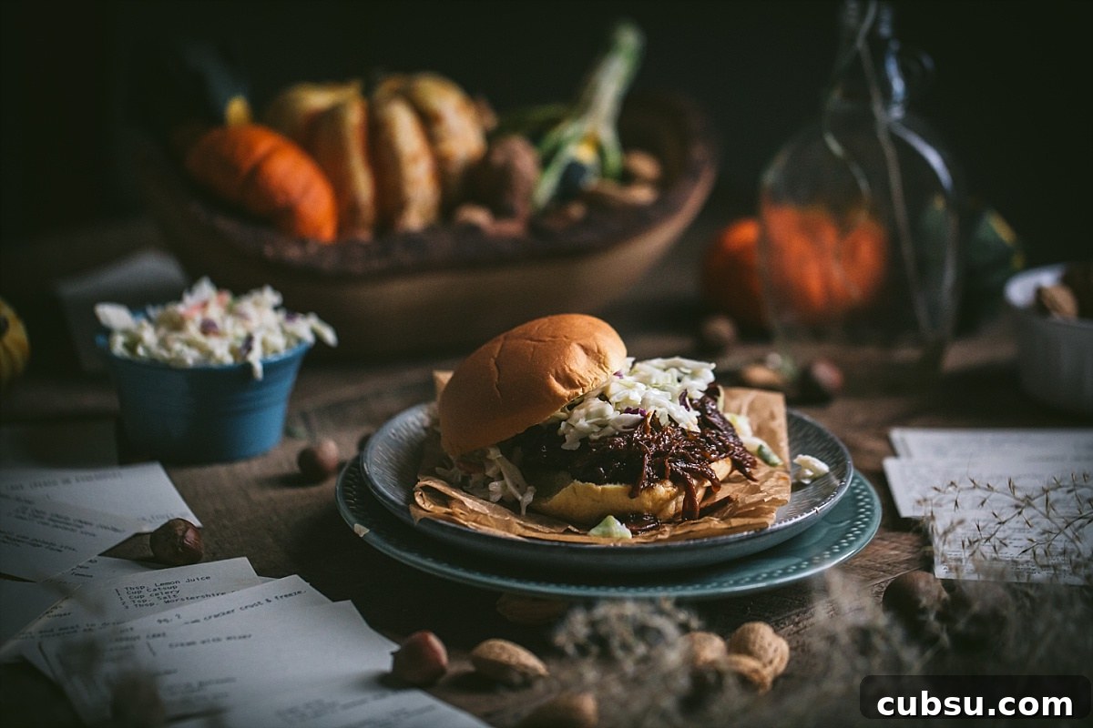 hot shredded beef bbq sandwich for a crowd surrounded by fall decor