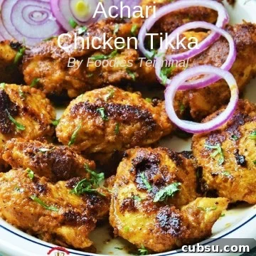 Achari Chicken Tikka Recipe served with onion rings