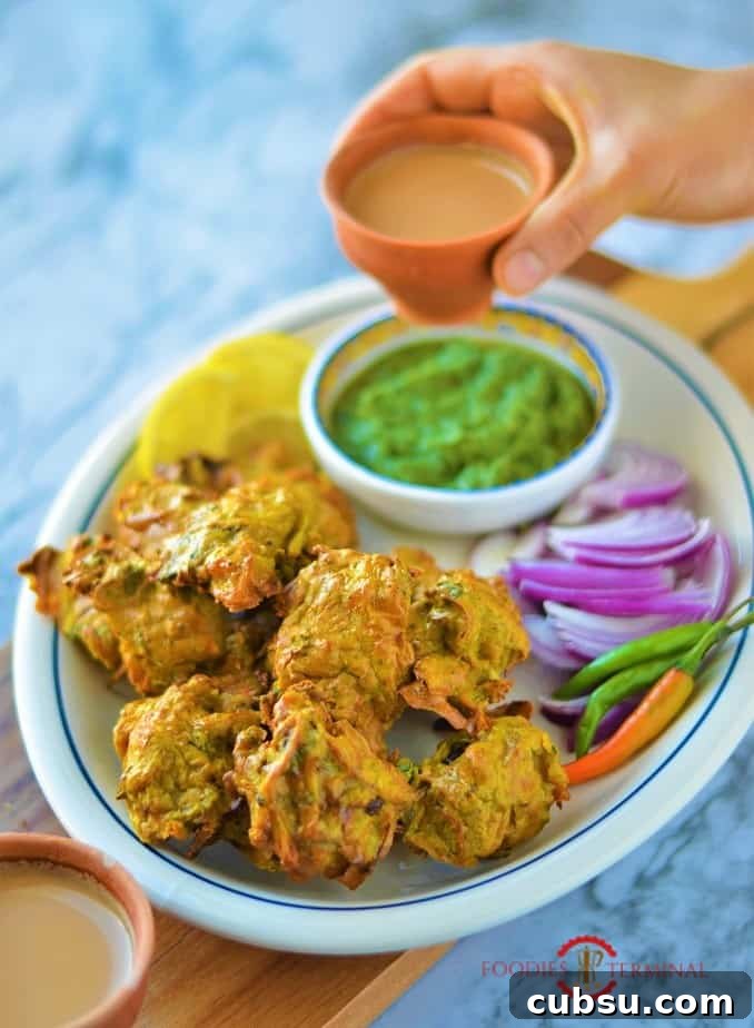Chicken pakora served with accompaniments & indian tea in clay cups