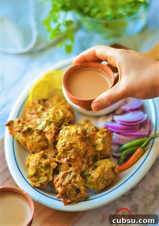 Chicken pakora in air fryer served with chai in terracotta cups