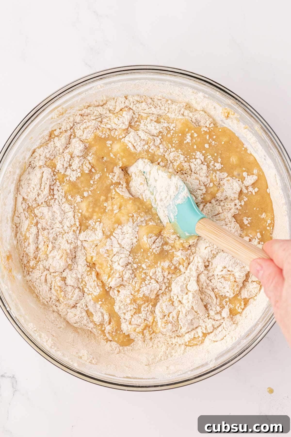Moist Greek Yogurt Banana Bread Recipe for Tender Loaves 11 stirring the dry ingredients into the wet ingredients