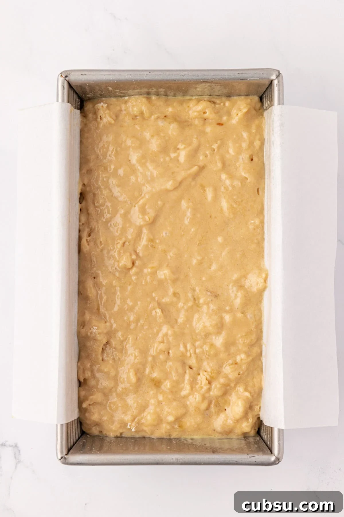 Moist Greek Yogurt Banana Bread Recipe for Tender Loaves 13 greek yogurt banana bread batter in a loaf pan