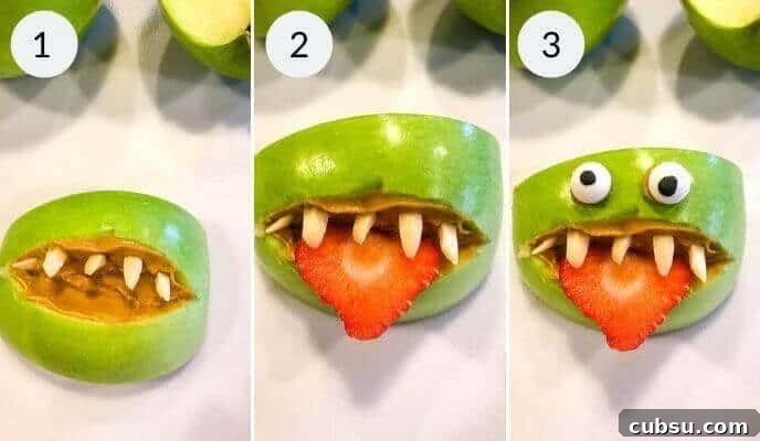 Halloween Apple Monster Snack Ideas 6 Putting the teeth and tongue in.