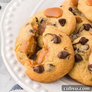 Cookies on a white platter with one cut in half.