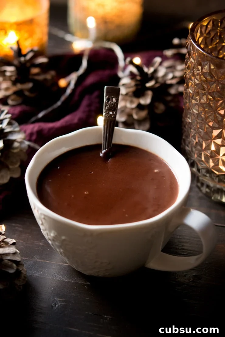 Italian hot chocolate in a white mug with a spoon