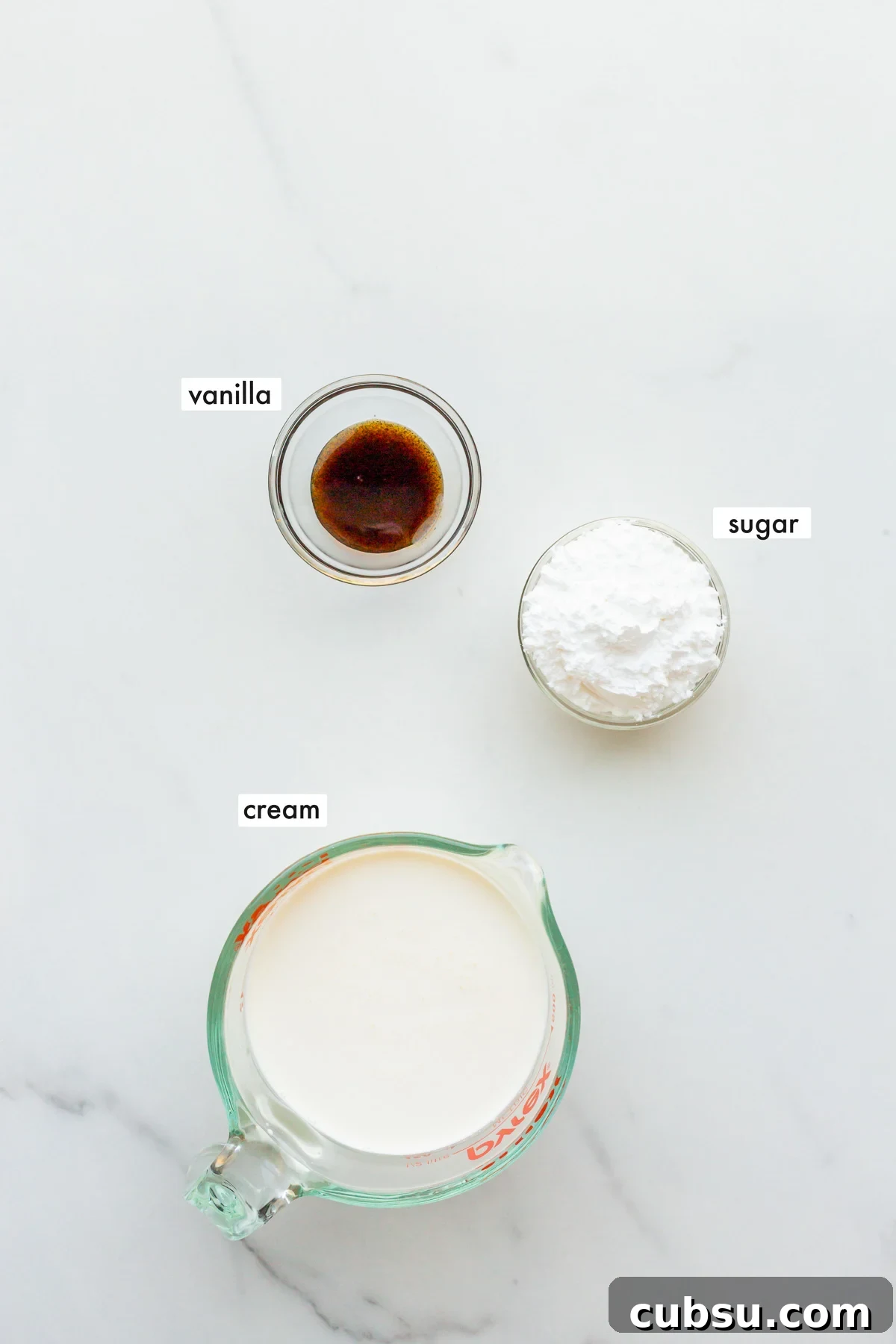 Ingredients to make vanilla bean whipped cream measured out.