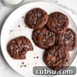 25 Creative Uses for Sourdough Discard: Recipes & Tips 11 A white plate with chocolate sourdough cookies with sea salt on top.