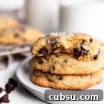 25 Creative Uses for Sourdough Discard: Recipes & Tips 13 A stack of 3 sourdough chocolate chip cookies with milk in the back.