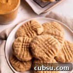 25 Creative Uses for Sourdough Discard: Recipes & Tips 14 A plate of cookies with a jar of peanut butter in the back.