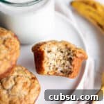 25 Creative Uses for Sourdough Discard: Recipes & Tips 19 A plate with banana muffins and a glass of milk with a banana.