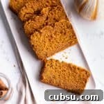25 Creative Uses for Sourdough Discard: Recipes & Tips 23 A plate with slices of pumpkin bread.