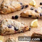 25 Creative Uses for Sourdough Discard: Recipes & Tips 7 Scones that blueberries and a lemon glaze with fresh lemons and blueberries.