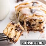 25 Creative Uses for Sourdough Discard: Recipes & Tips 8 A chocolate chip sourdough scone with a fork taking a piece out of it.