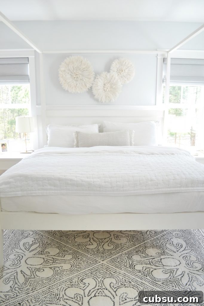 a big white canopy bed