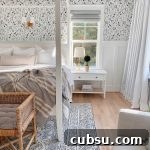 a white canopy bed with wallpaper