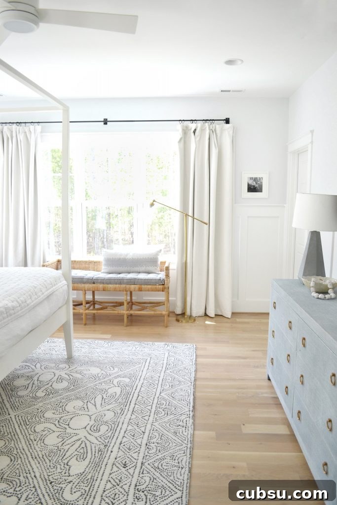 white drapes in an all white bedroom