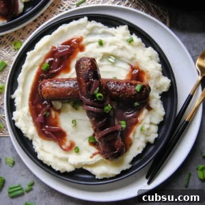 Diet-Friendly Bangers and Mash Recipes for Every Diet 4 overhead view of bangers and mash on a black plate