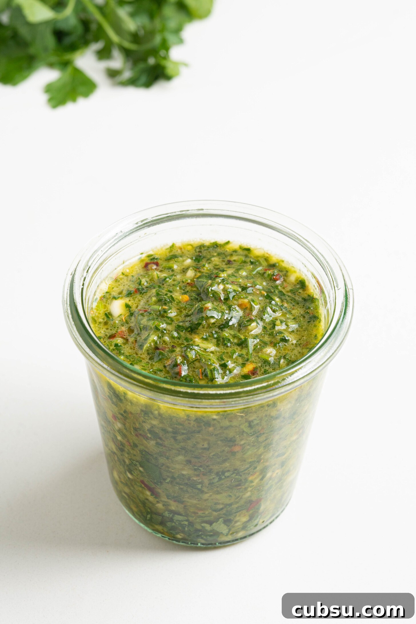 A bowl of chimichurri sauce.