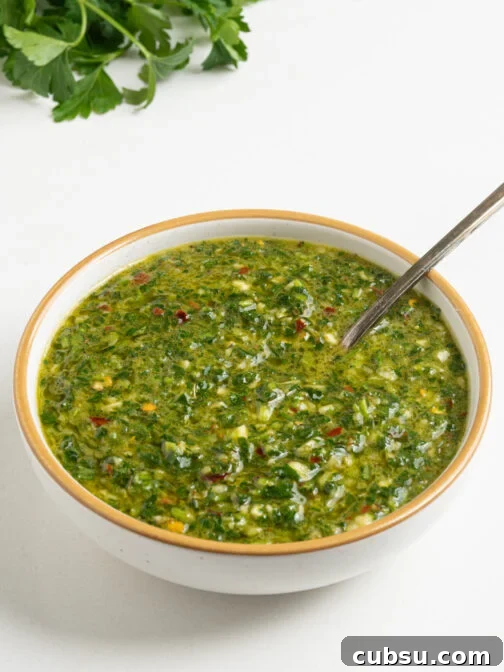 A bowl of chimichurri sauce.