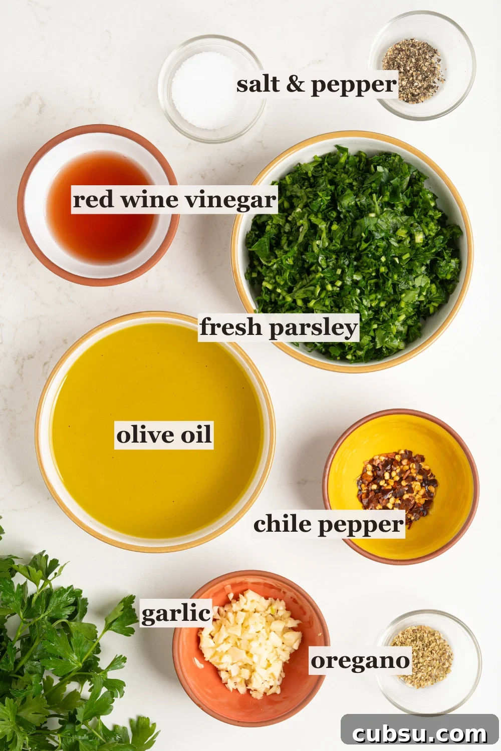 Bowls of oil, parsley, vinegar, and more.