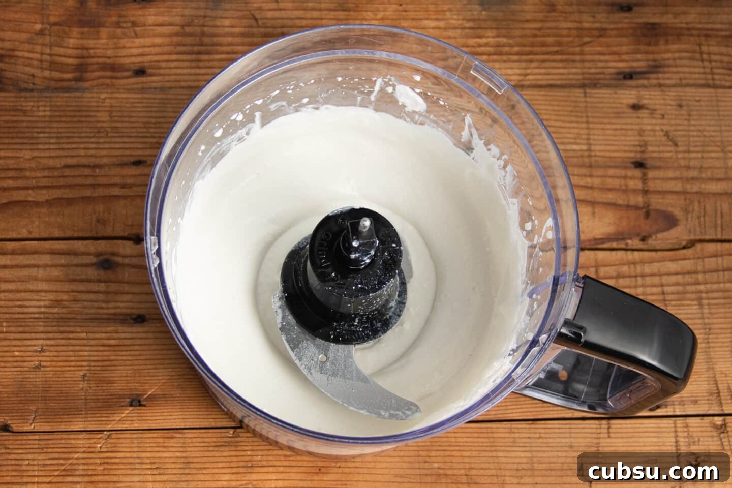 This is a picture of a blender with cottage cheese.