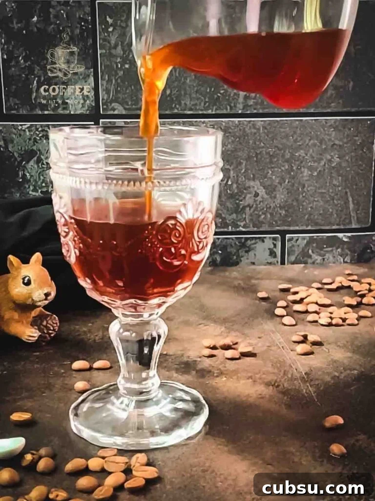 Pour the maple syrup into your serving glass.