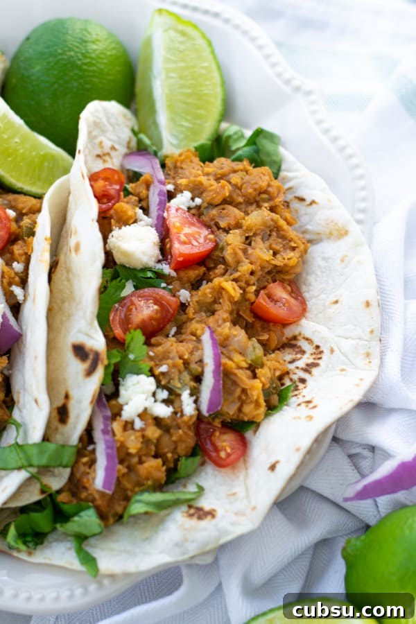 red lentil taco filling in a flour tortilla