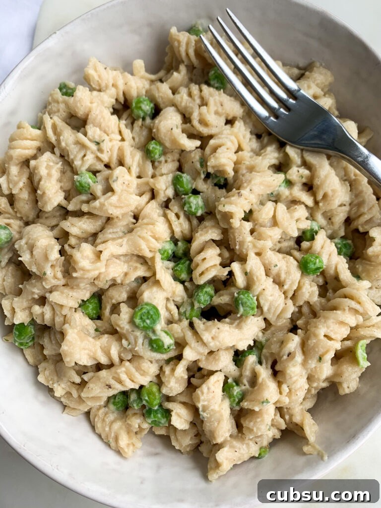 a white bowl of creamy cauliflower pasta