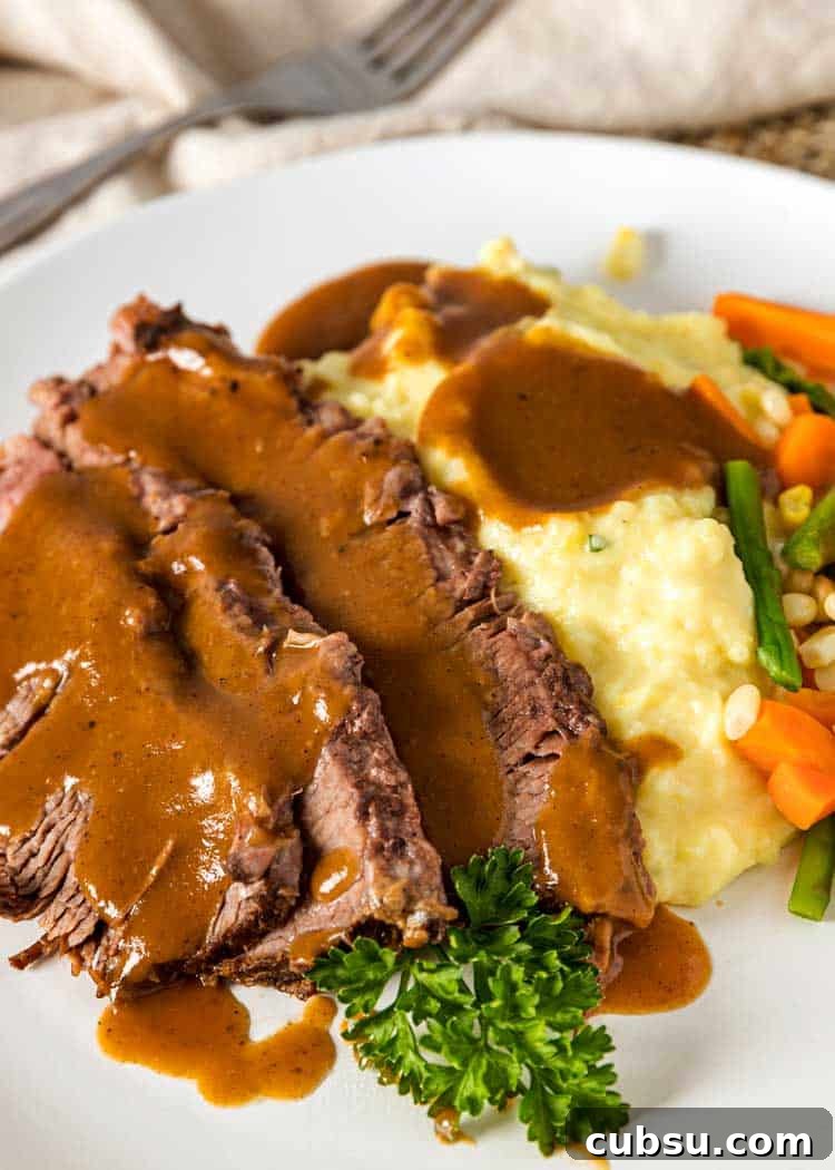 Yankee Pot Roast starts with a pan seared, seasoned beef brisket that gets braised then served with vegetables and a gravy made from the braising liquid. sliced Yankee Pot Roast with gravy, mashed potatoes and steamed vegetables