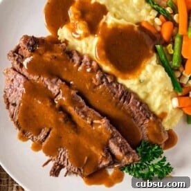 Classic Yankee Pot Roast Recipe for Tender Slow-Cooked Beef 3 slices of Yankee Pot Roast and gravy and vegetables