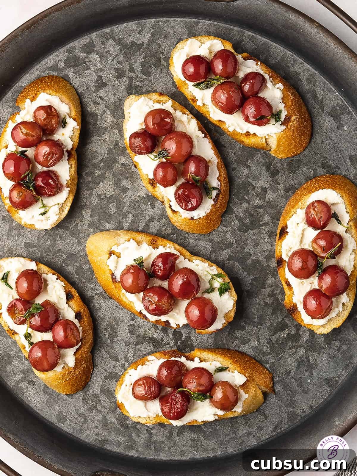 Roasted Grapes Recipe: Sweet Caramelized Grapes for Savory Dishes 4 plate of crostini with red grapes and ricotta