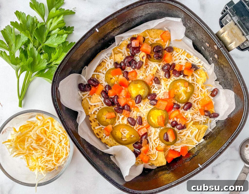 Top your chips with cheese and toppings before frying