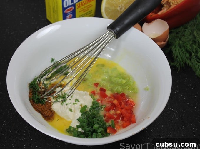 Crispy Dungeness Crab Cakes with Lemon Aioli Recipe 4 Combining filling ingredients for crab cakes.