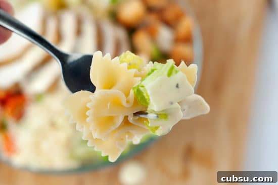 Fast Chicken Caesar Salad on a silver fork.