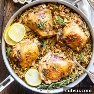 Rosemary Roasted Chicken with Creamy Parmesan Orzo 6 overhead image of chicken in a pan with orzo