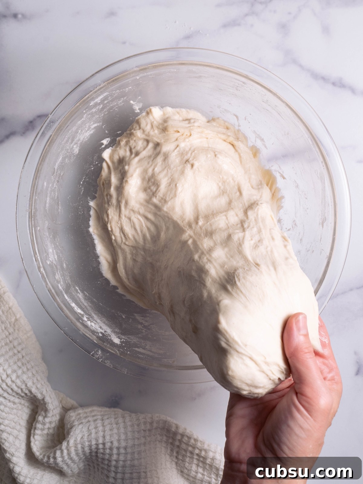 Rosemary Sea Salt Sourdough Bread Recipe for Crispy Crust 4 Stretching sourdough to build gluten