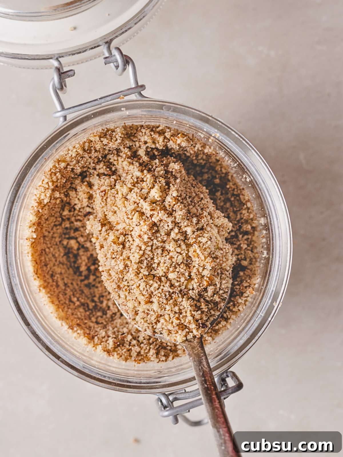 How to Make Pecan Flour at Home for Baking and Paleo Recipes 6 processed nuts in a jar