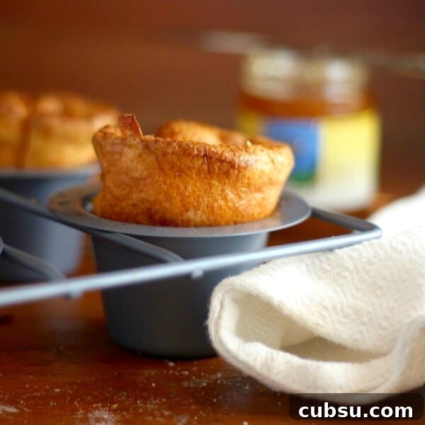 Weekly Meal Plan: Sept 3–9, 2024 – 7-Day Dinners & Prep Guide 5 Closeup of golden cornmeal popovers in a popover pan with a white towel underneath.