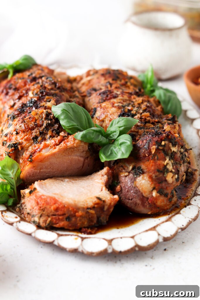 Week 21 Paleo Meal Plan: 7-Day Recipes & Grocery List 7 side view of whole30 pork tenderloin sliced up