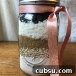 Cookie ingredients layered in a Mason jar