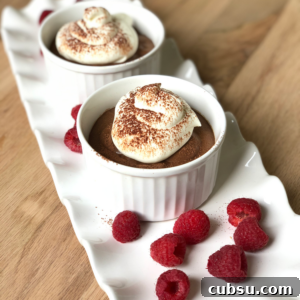 Christiane’s Classic Chocolate Mousse Recipe 6 Small bowls of chocolate mousse on a long white tray.