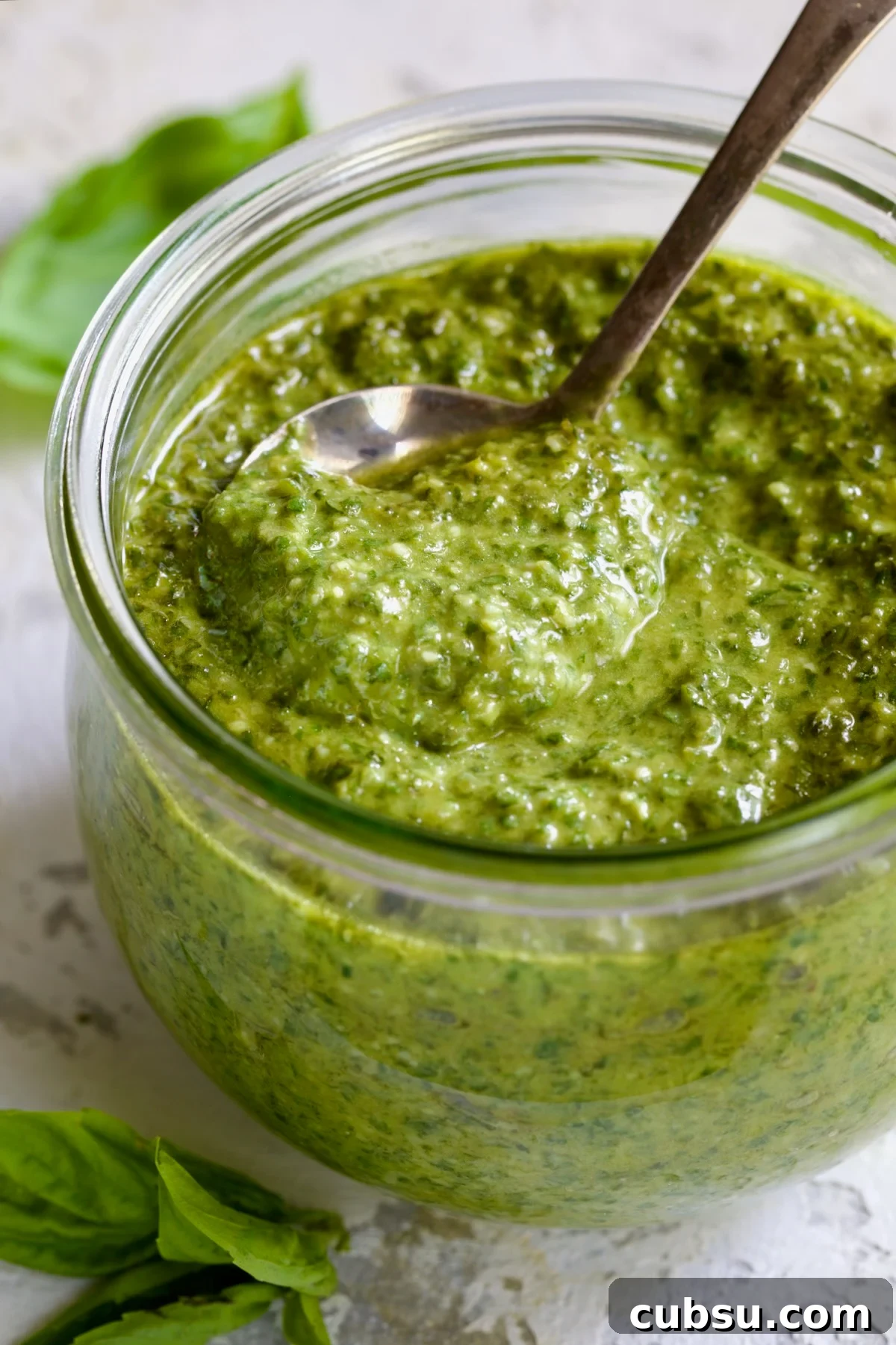 Jar of Pesto Genovese with spoon.