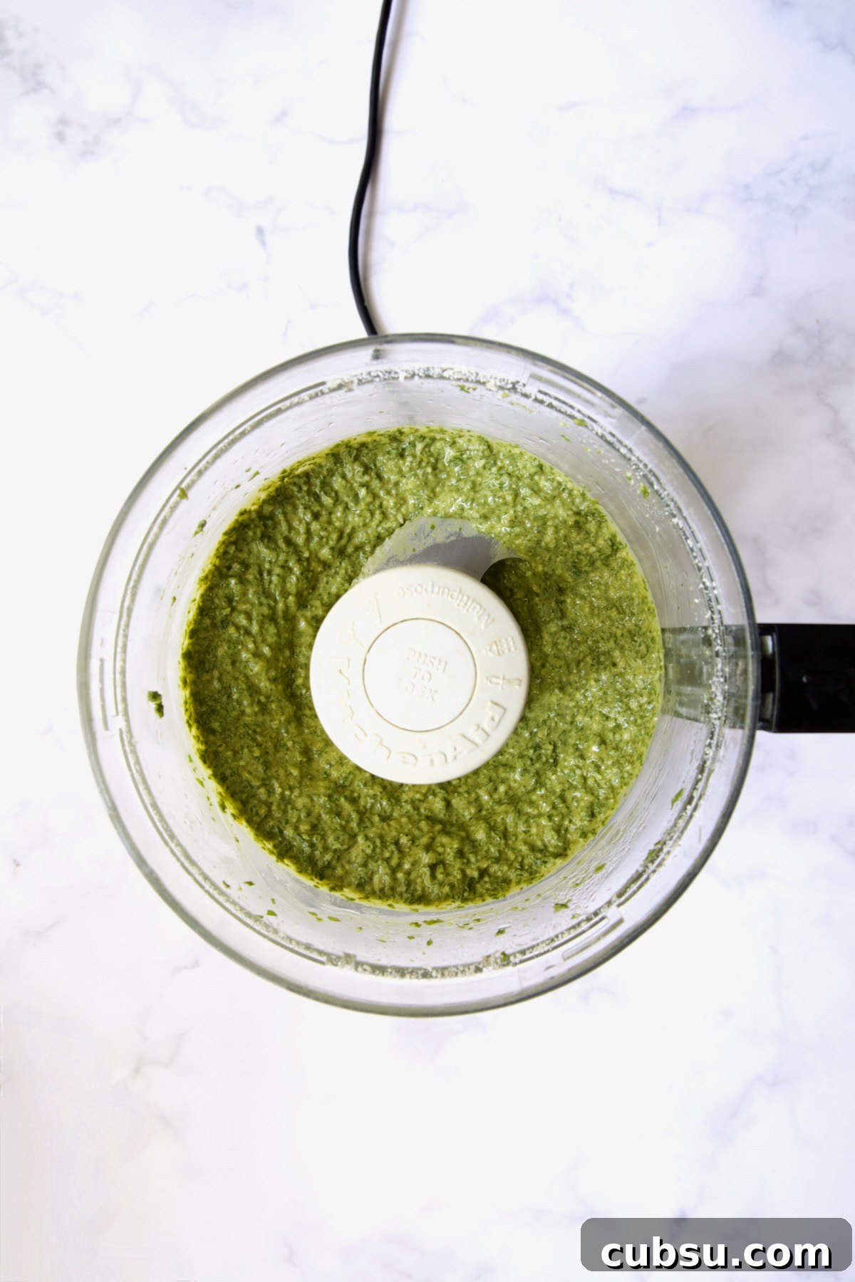 Finished pesto in food processor.