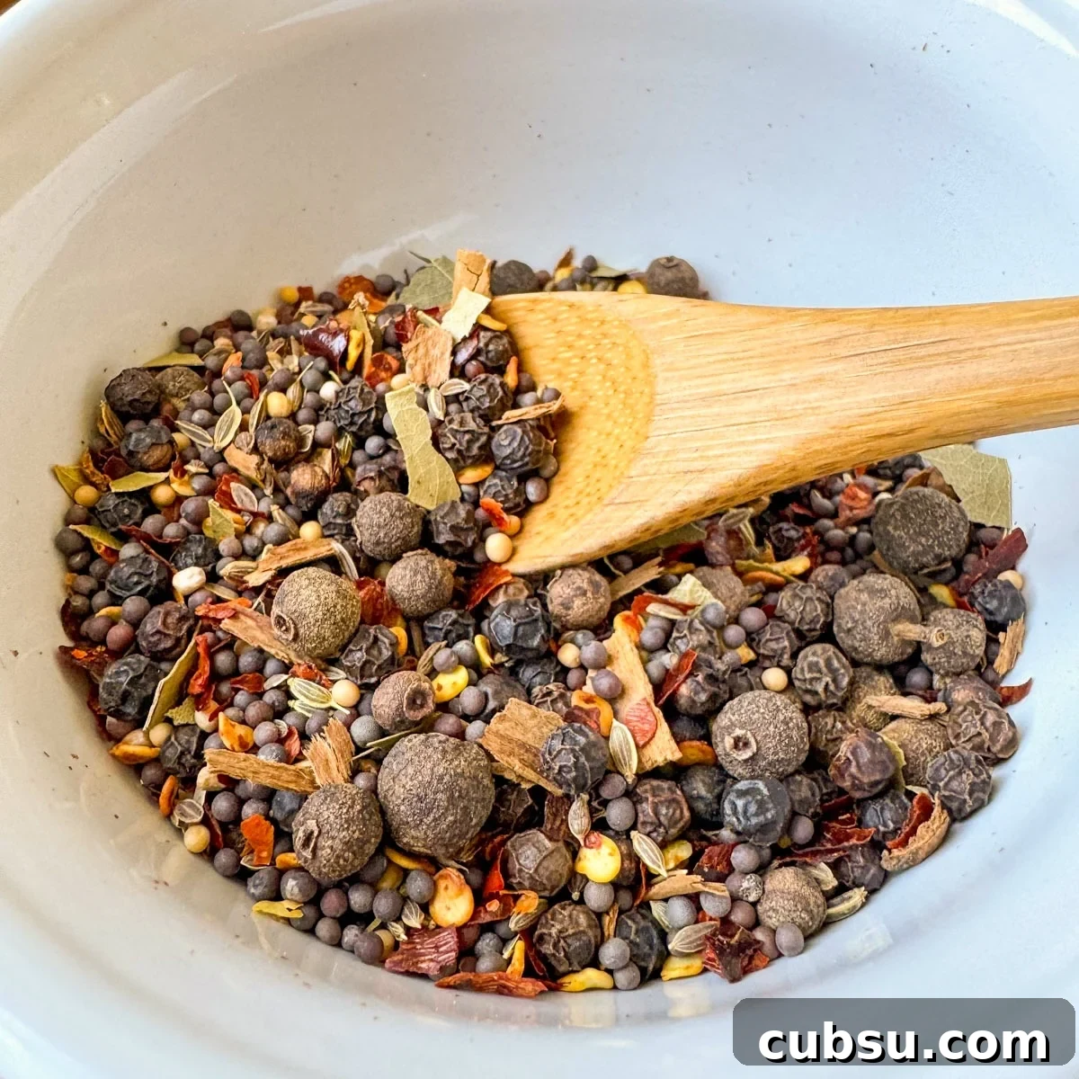 Customizable Pickling Spice Blend Recipe for Every Jar 5 pickling spice recipe mixed in white bowl
