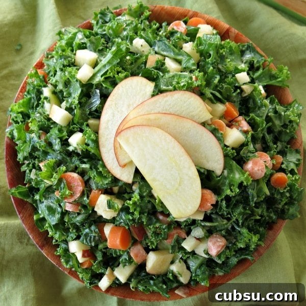 Kale Apple Slaw in bowl with apples fanned on top